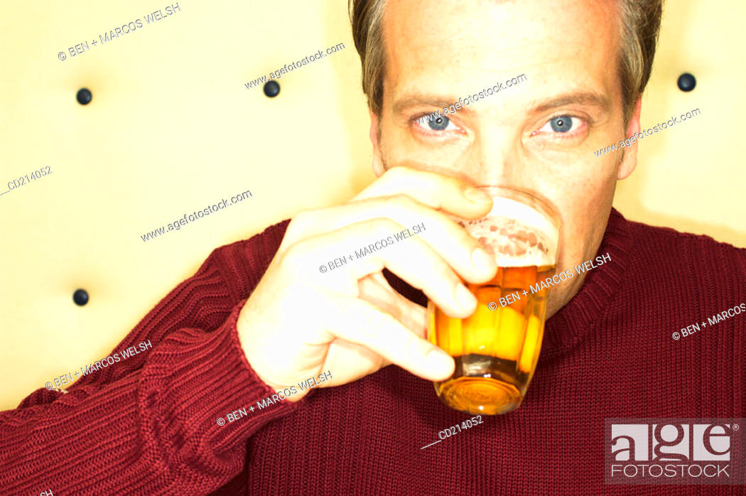 Stock Photo: Man drinking beer.