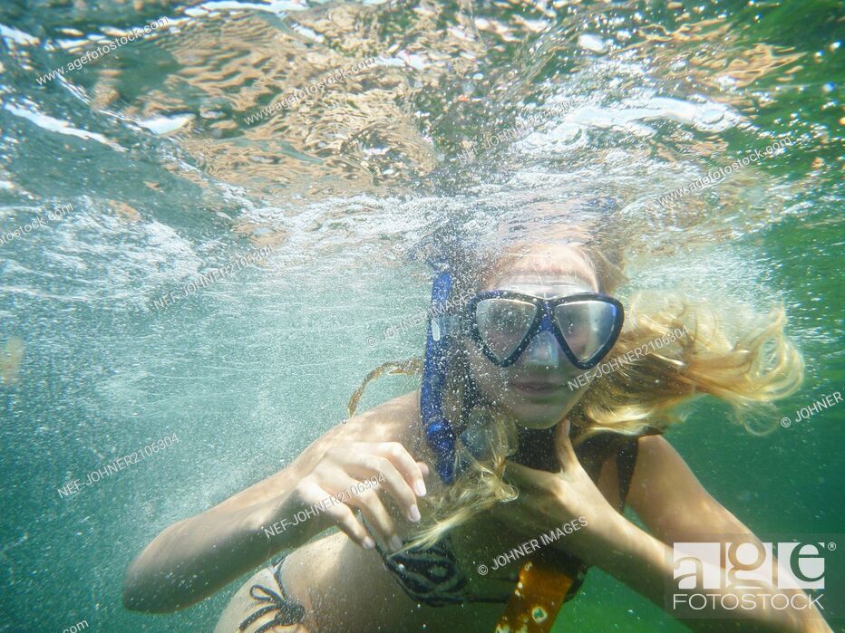 Stock Photo: Girl swimming in scuba mask.