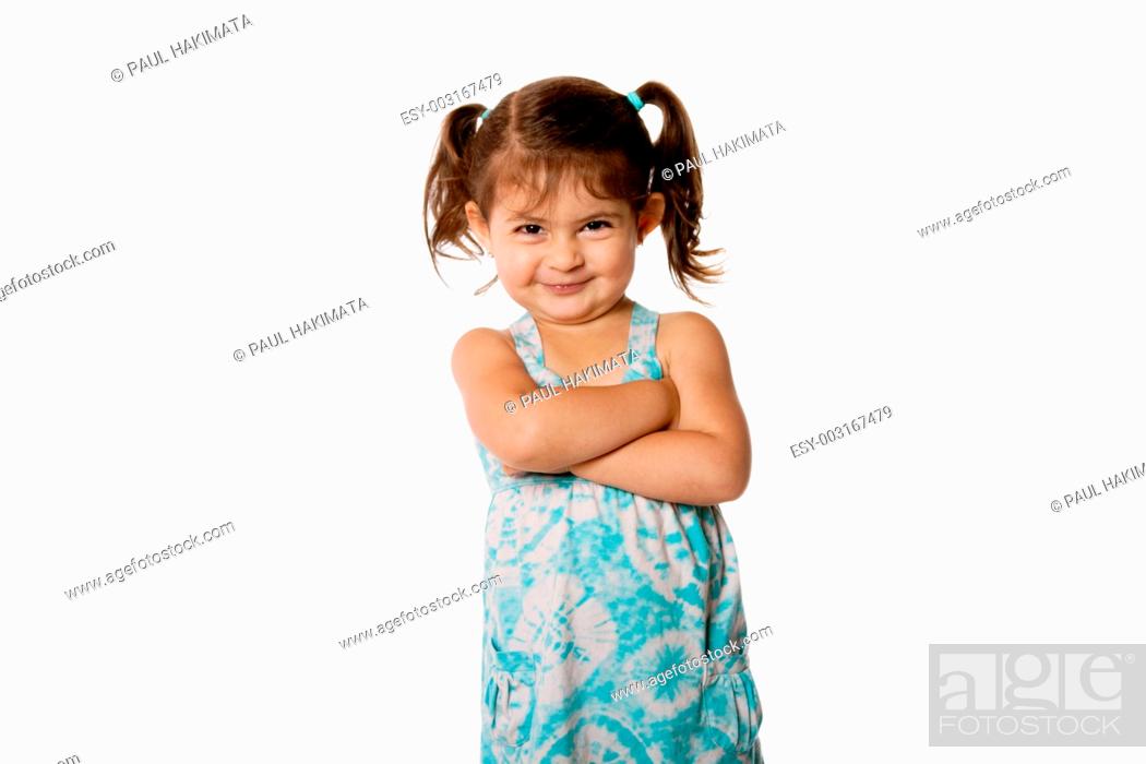 Cute little young toddler girl with attitude smirk, arms crossed and  pigtails in hair, Stock Photo, Picture And Low Budget Royalty Free Image.  Pic. ESY-003167479 | agefotostock