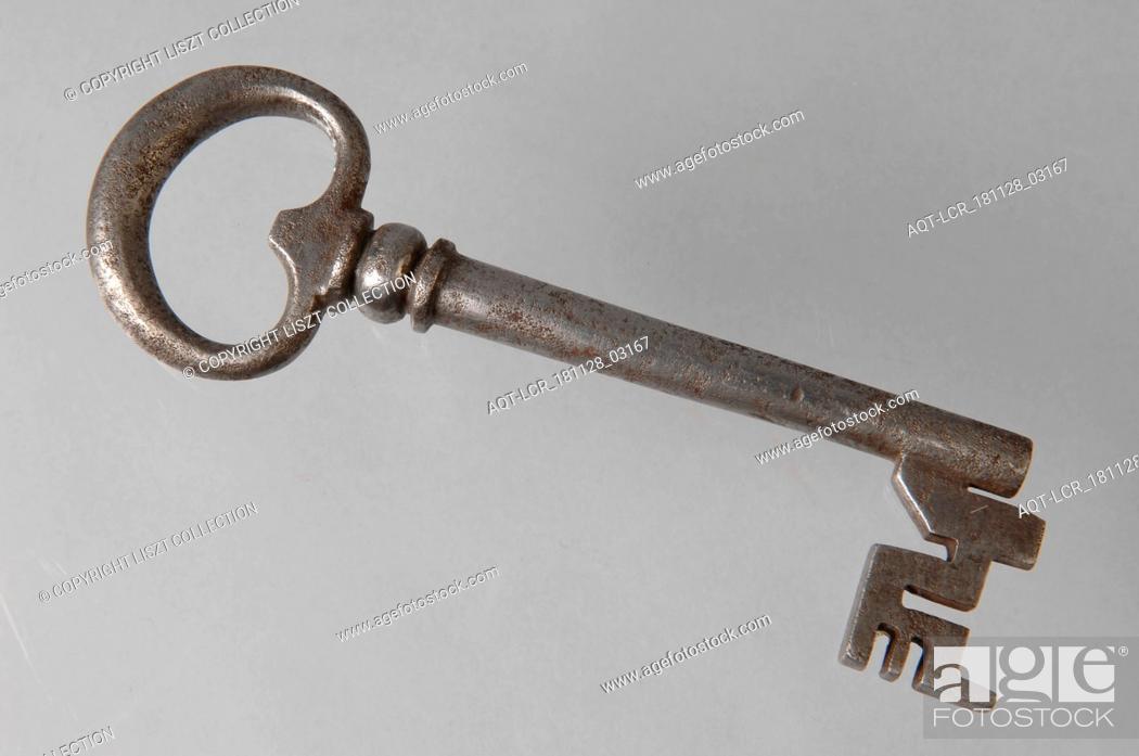 Stock Photo: Iron key with heart-shaped eye, solid key handle, collar and cruciform beards in beard, key iron iron, hand forged Key with heart-shaped eye (handle) solid.