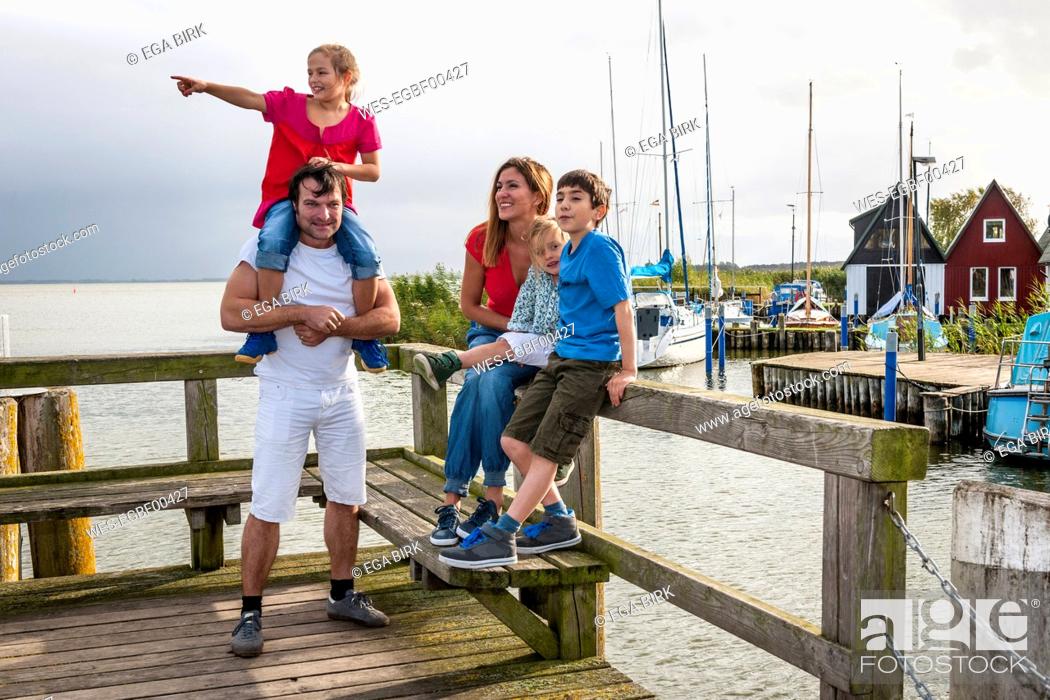 Stock Photo: Happy family on a pier, Ahrenshoop, Mecklenburg-Western Pomerania, Germany.