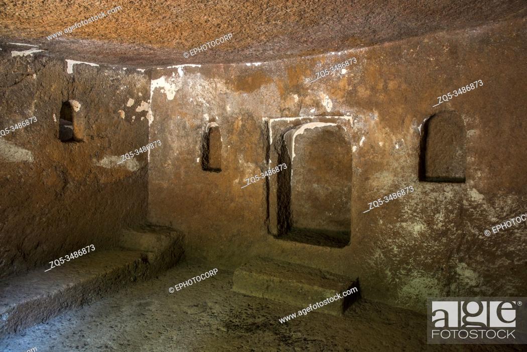 Stock Photo: Panhale Kaji or Panhalakaji Caves, District- Sindhudurg, Maharashtra, India : Interior of Cave No. 9 showing niches and a low rock-cut bench on the eastern side.