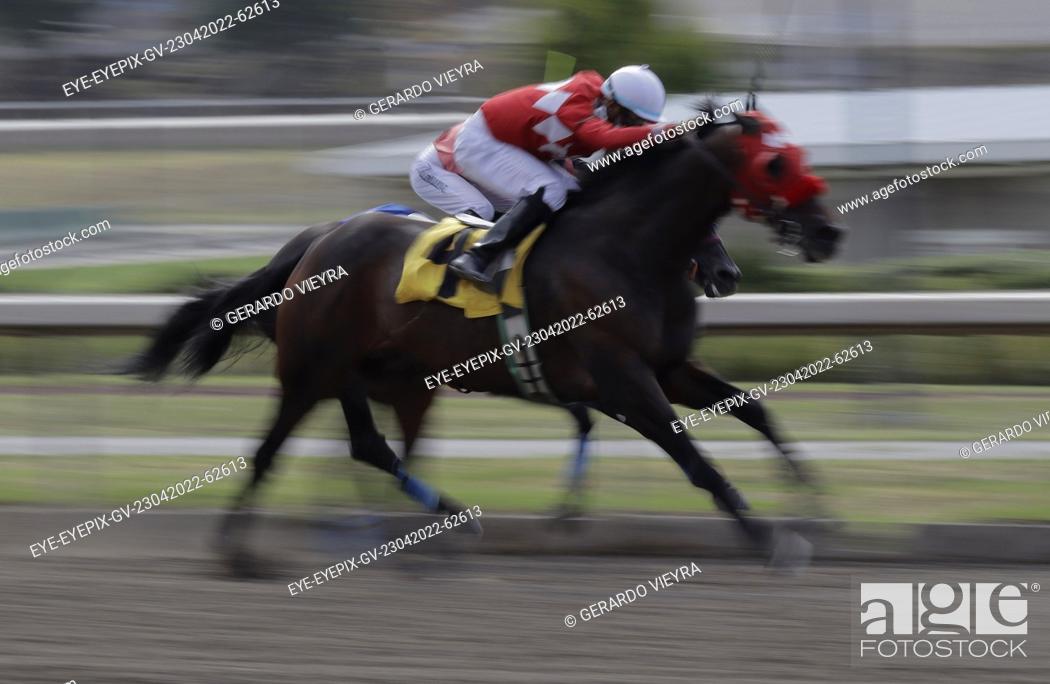 Stock Photo: MEXICO CITY, MEXICO - APR 23, 2022: A Jockey during a horse race as part to Botarga contest at the Hipódromo de las Américas.
