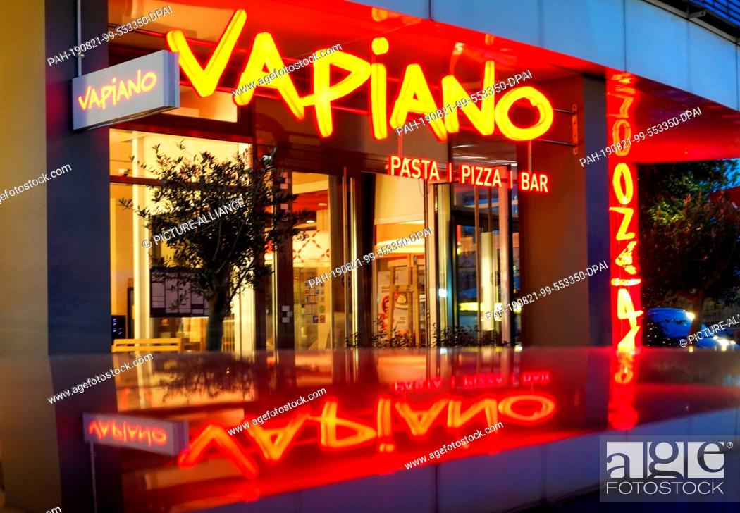 Stock Photo: 19 August 2019, Berlin: The entrance to a restaurant of the chain Vapiano. The Cologne-based company intends to continue its restructuring course.
