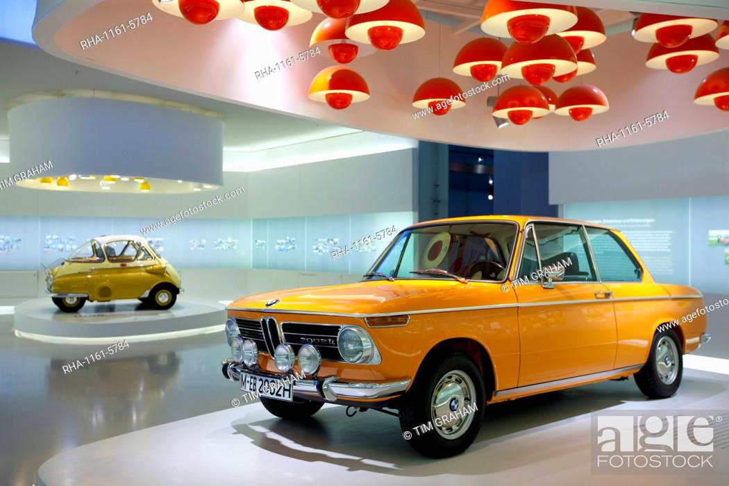 Stock Photo: BMW 2002 TI car and Bubble Car Isetta 1955 on display at the BMW Museum and Headquarters in Munich, Bavaria, Germany.