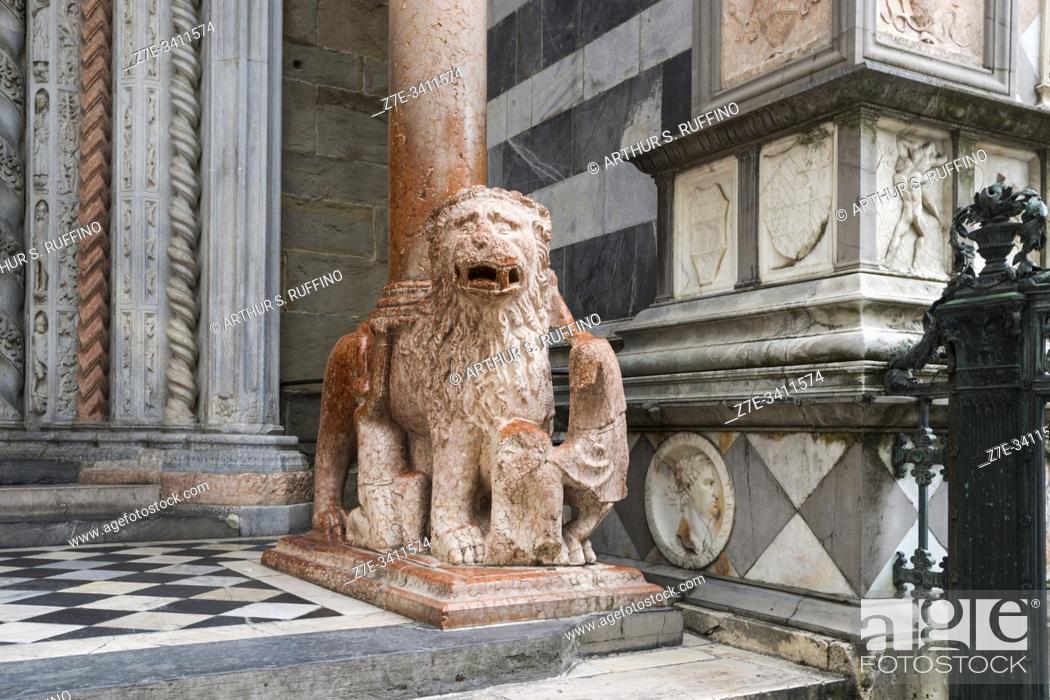 Stock Photo: One of two red-marble lions supporting the columns of the northern portal arch of the Basilica of Santa Maria Maggiore, Piazza del Duomo.