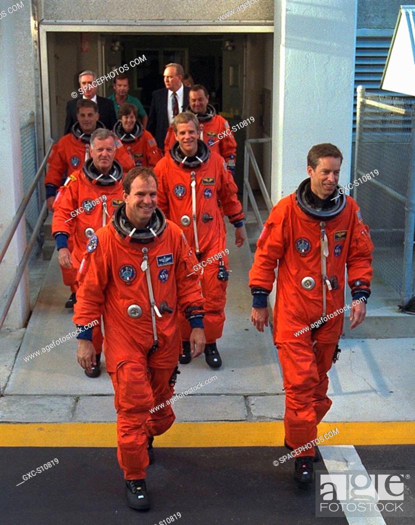 Stock Photo: 09/09/1997 --- STS-86 Commander James D. Wetherbee, in foreground at right, leads the way as the next Space Shuttle crew does a practice walkout from the.