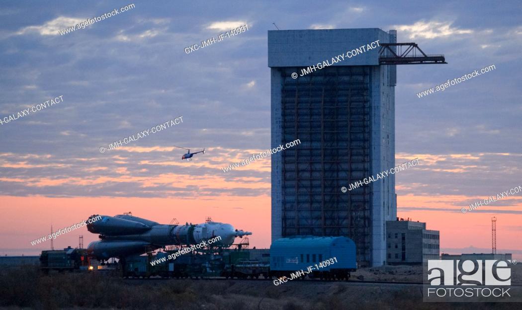 Stock Photo: The Soyuz TMA-14M spacecraft is rolled out to the launch pad by train on Sept. 23, 2014 at the Baikonur Cosmodrome in Kazakhstan.