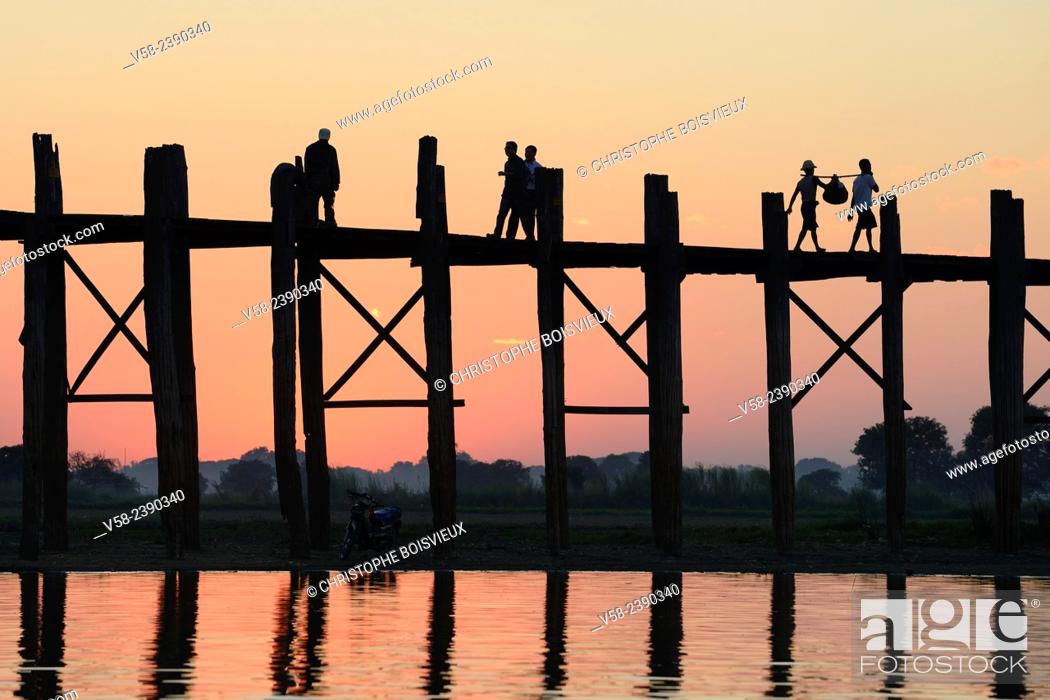 Stock Photo: Myanmar, Amarapura, U Bein bridge and lake Taungthaman at sunset.