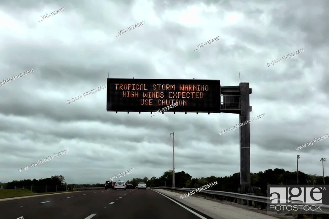 Stock Photo: Road sign on I-75N warning motorists of intense winds in Fort Myers, Florida As the Gulf Coast states are preparing to be hit by Tropical Storm Isaac after the.