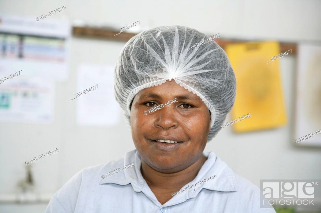 Photo de stock: Woman in the canteen, kitchen of the refinery and harbour area of the Ramu Nickel Mine, chinese mining company, Basamuk, Papua New Guinea, Melanesia.
