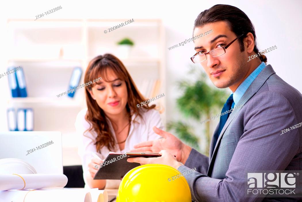 Stock Photo: Businessman and female architect discussing new project.