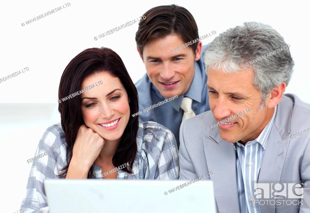 Stock Photo: Confident business partners working at a computer in an office.