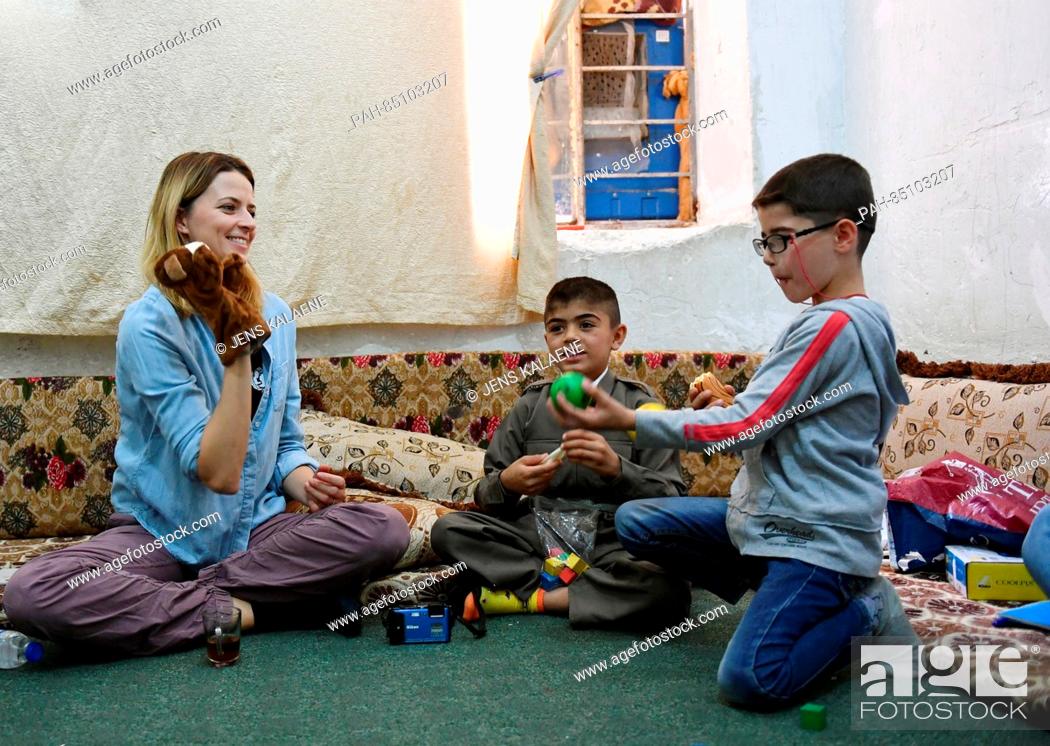 Stock Photo: EXCLUSIVE - UNICEF ambassador Eva Padberg visits the family of nine-year-old Murat (C) in a refugee camp for Syrian refugees in the Dohuk region, Iraq.