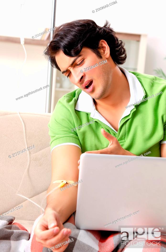 Stock Photo: Young man suffering at home.