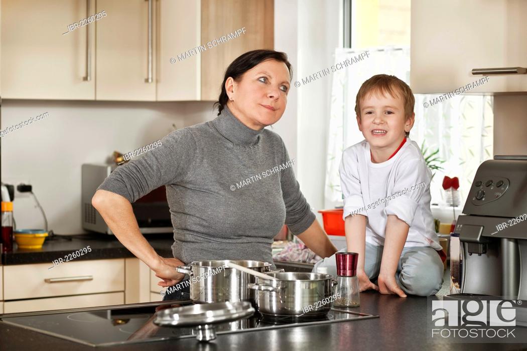 Stock Photo: Mother and son in the kitchen.