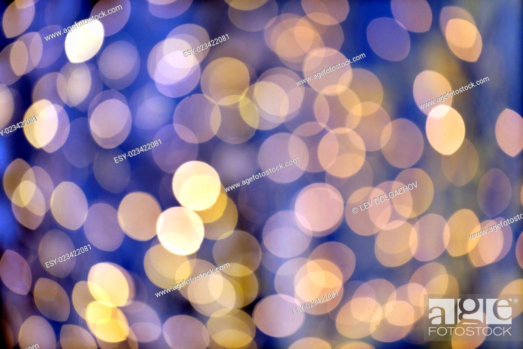 Stock Photo: christmas, holidays and background concept - blurred blue and golden lights bokeh.
