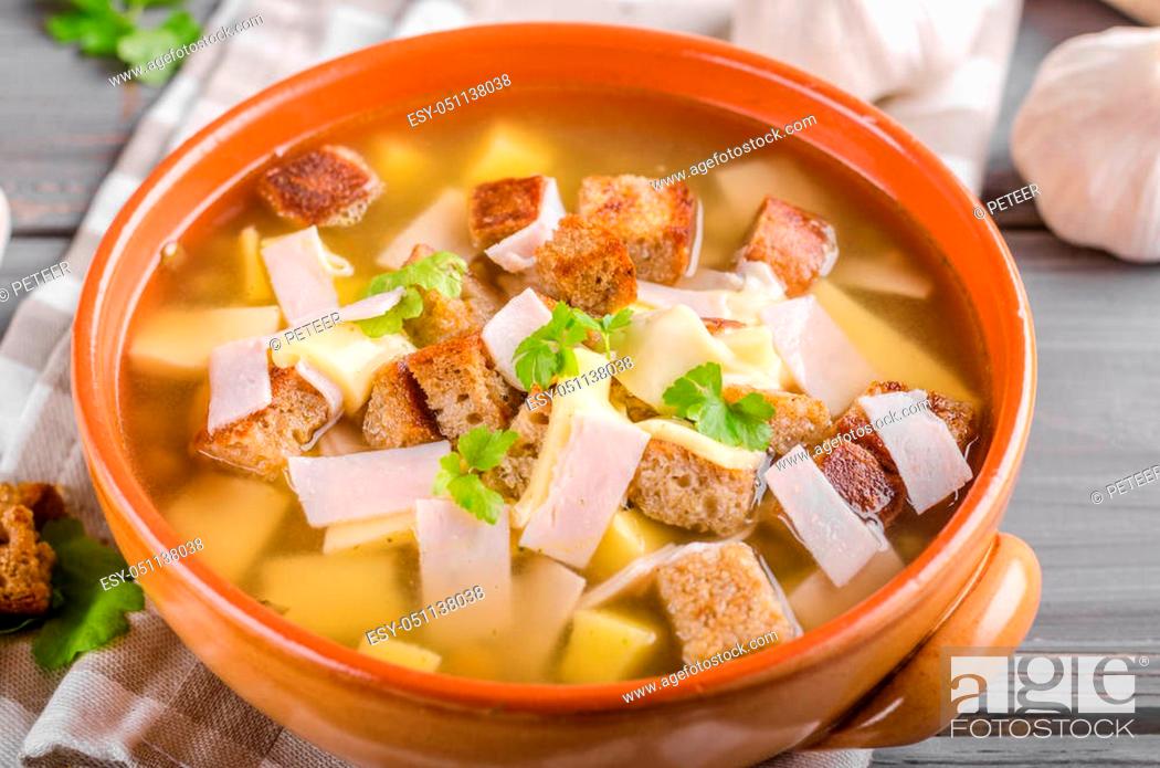 Stock Photo: Garlic soup with cheese, ham and croutons.