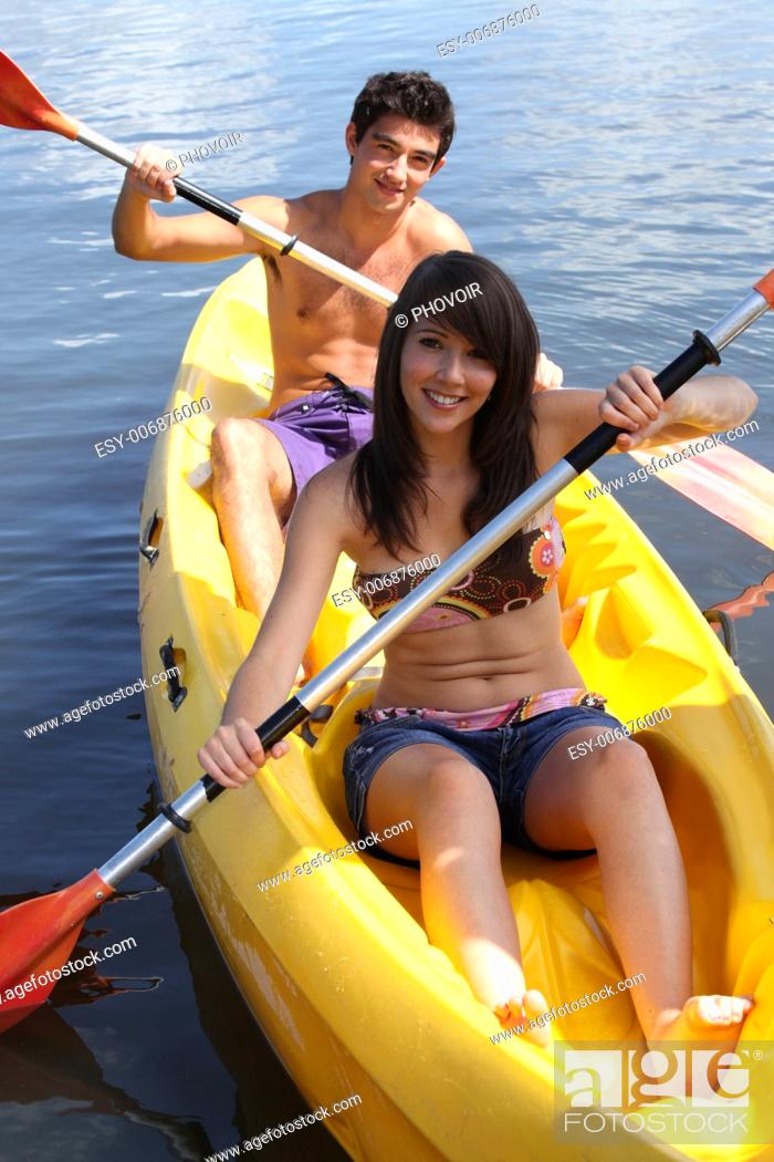 Stock Photo: young couple canoeing.