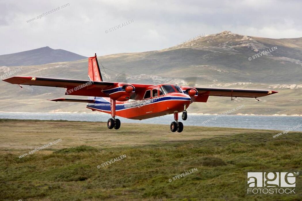 Stock Photo: Saunders Island. Falkland Islands. 03. 18. 08. FIGAS (Falkland Islands Government Air Services) Bitten-Norman Islander twin engined aircraft landing at Saunders.