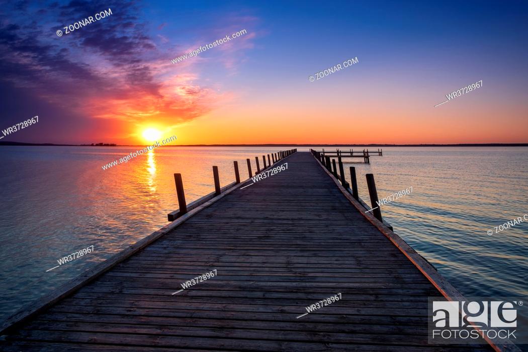 Stock Photo: Beautiful romantic colorful sunset over a calm lake.