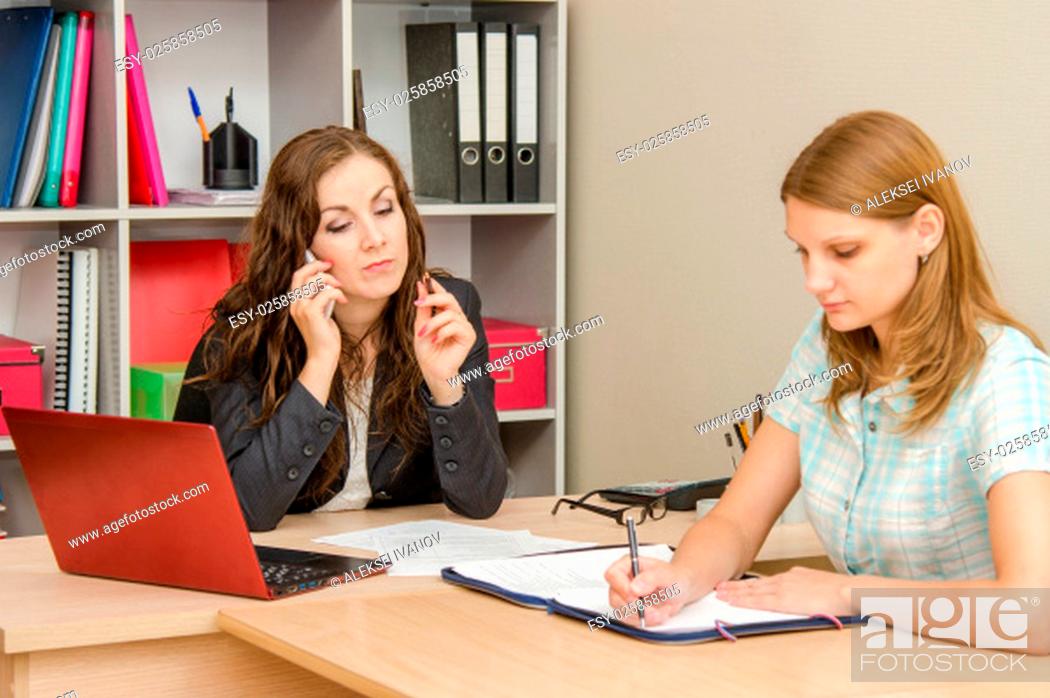 Stock Photo: Young beautiful girl on reception at the office specialist.