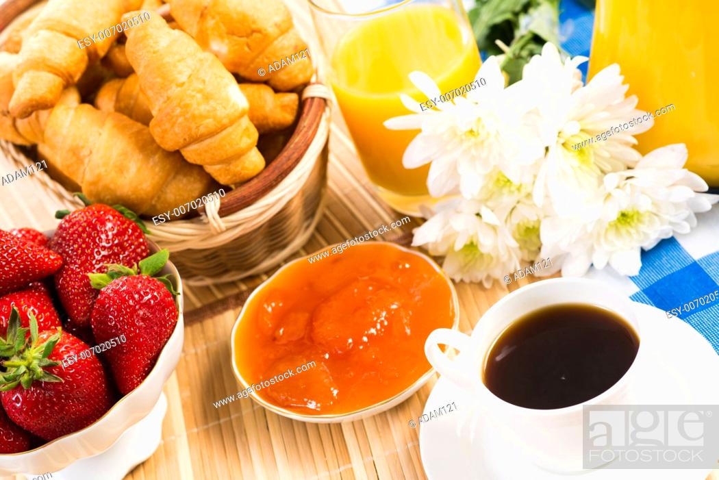 Stock Photo: continental breakfast: coffee, strawberry, croissant and juice.