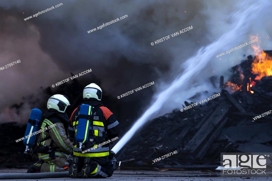 Stock Photo: Fire fighters pictured at the site of IOK recycling and waste management company, in Beerse, Monday 28 March 2022. BELGA PHOTO KRISTOF VAN ACCOM.