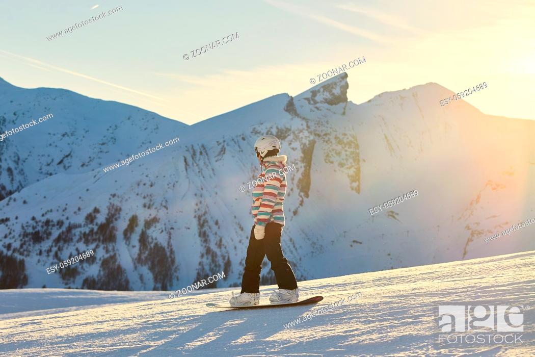 Stock Photo: Snowboarding in the alps, sunlight flare, Val d'Allos iconic peaks in the background.