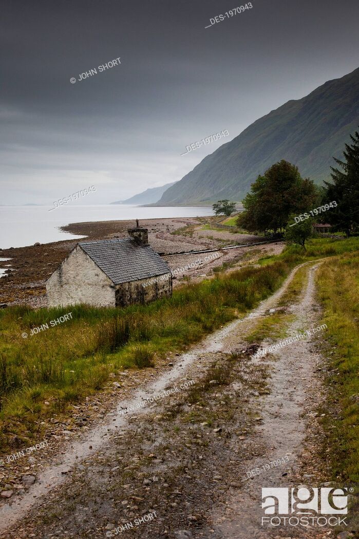 Stock Photo: a road and weathered house at the water's edge, ardnamurchan argyl scotland.