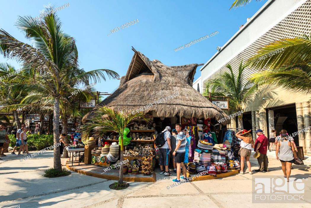 Stock Photo: Costa Maya, Mexico - April 26, 2019: Street view at day with tourists near souvenir shops in Costa Maya, Mexico. Today the town is one of Mexican most top.