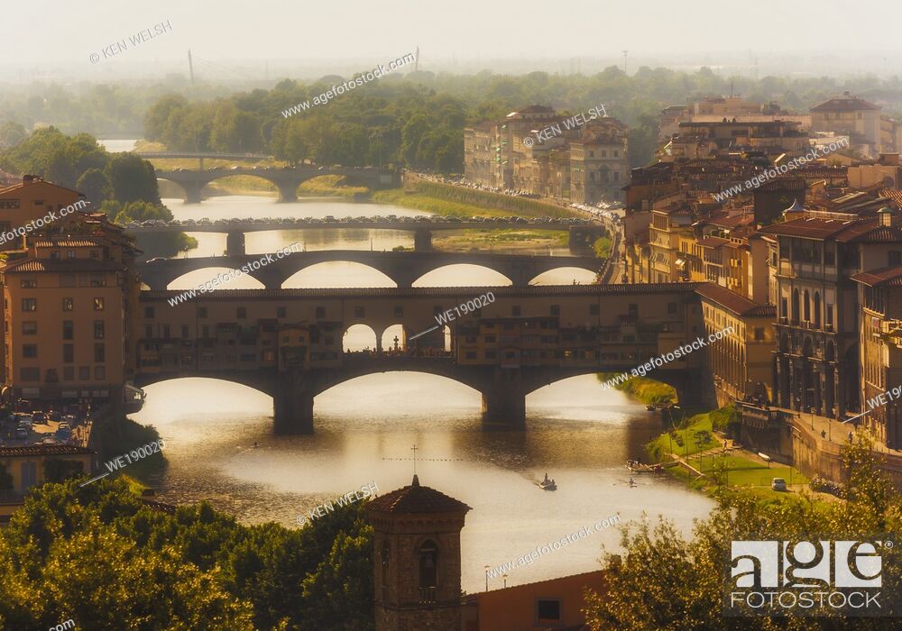 Stock Photo: High view along the Arno river to the Ponte Vecchio, the old bridge. Florence, Tuscany, Italy. The historic centre of Florence is a UNESCO World Heritage Site.