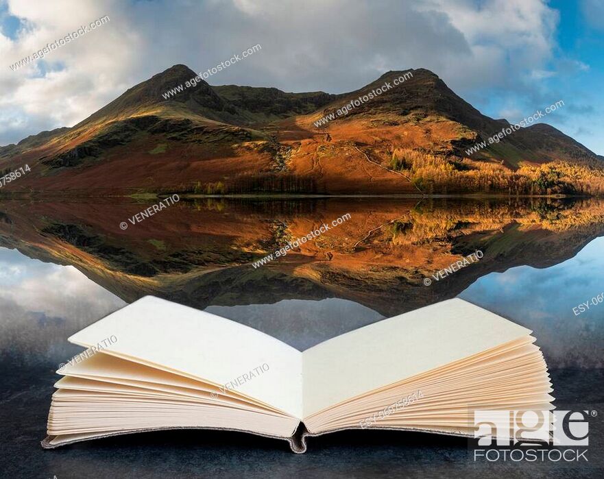 Stock Photo: Stunning epic Autumn Fall landscape Buttermere in Lake District with beautiful early morning sunlight playing across the hills and mountains coming out of pages.