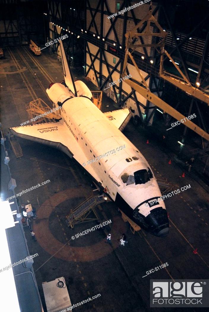 Stock Photo: 12/12/1997 --- The orbiter Endeavour awaits further processing in the transfer aisle of the Vehicle Assembly Building VAB.