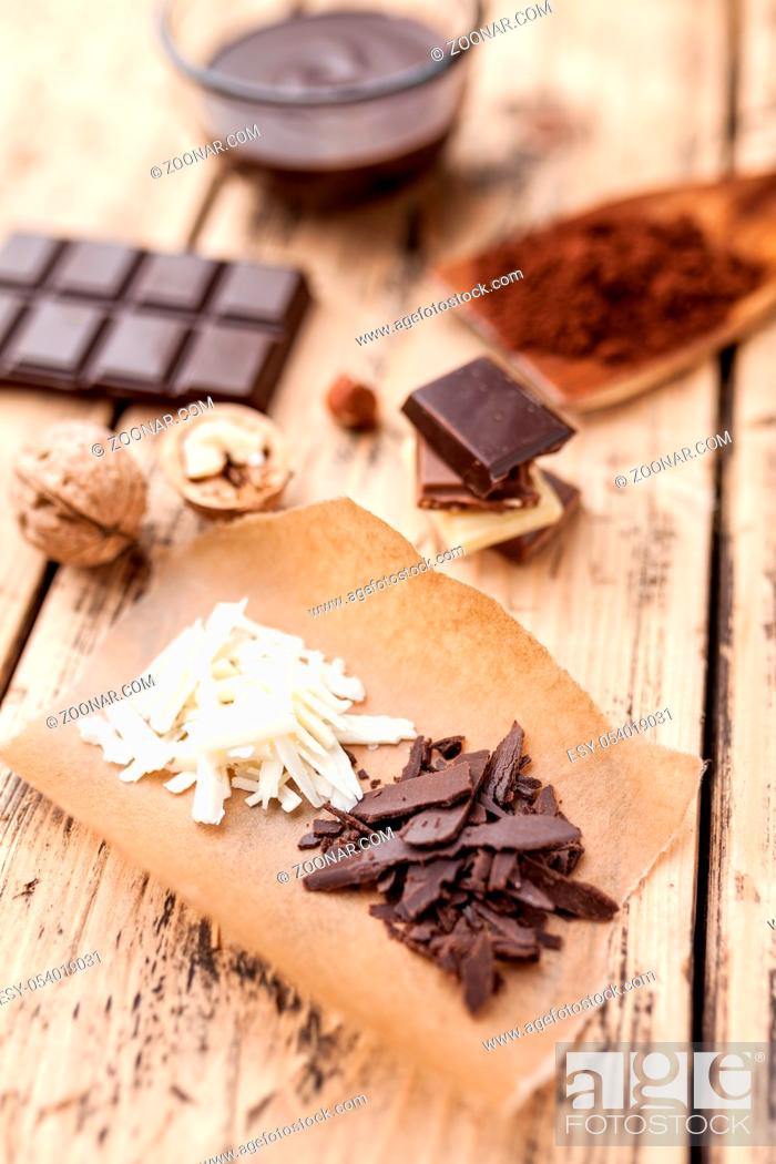 Stock Photo: Variety of delicious chocolate on wooden background.