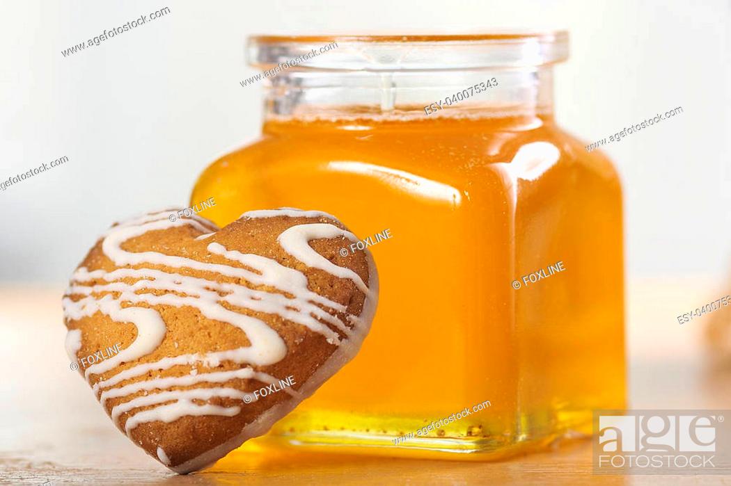 Stock Photo: Heart-shaped cookies and a jar of h.