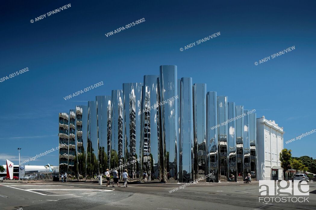 Stock Photo: Corner view across street towards polished building facade with existing Govett Brewster Art Gallery. Len Lye Centre, New Plymouth, New Zealand.