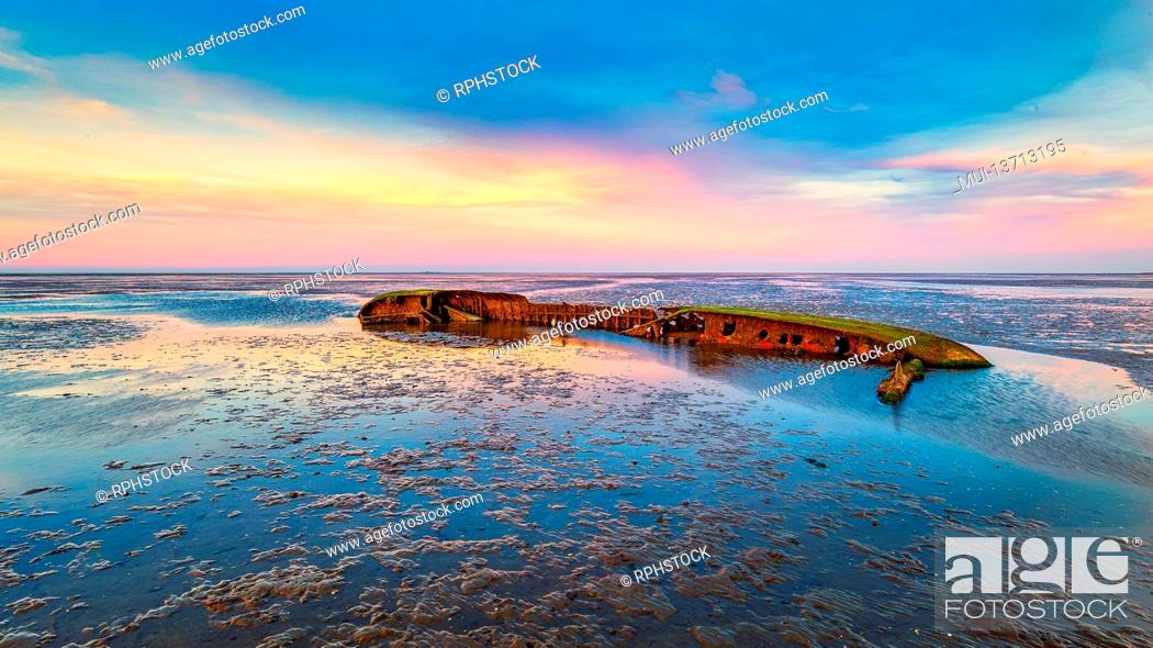 Stock Photo: An shipwreck in the wadden sea near Schillig, East Frisia.