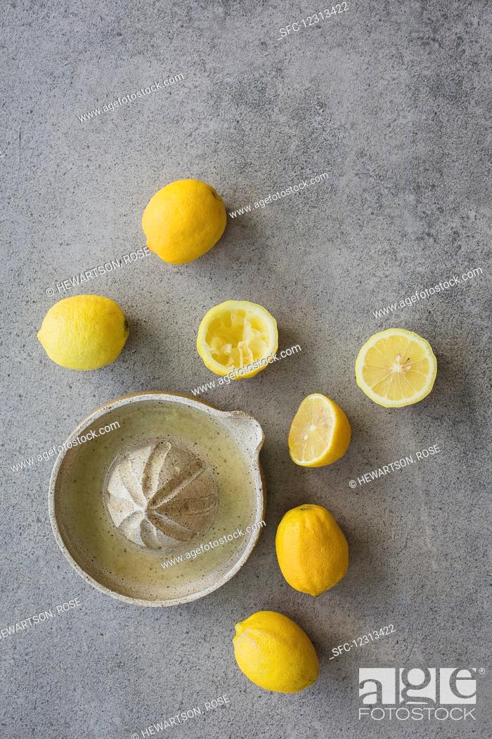 Stock Photo: Juicing homegrown organic lemons.