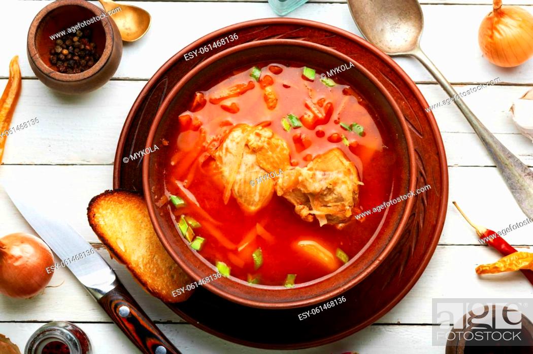 Stock Photo: Borscht - hot soup based on beets and meat. Red Ukrainian borscht.