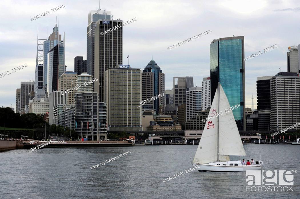 Stock Photo: Sailing boat in Sydney Cove, Sydney Harbour, at back the city centre, Central Business District, CBD, Sydney City, Sydney, New South Wales, NSW, Australia.