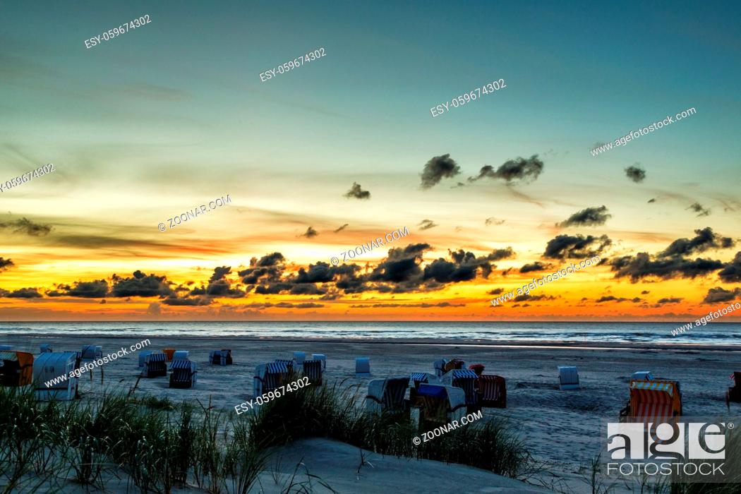 Stock Photo: Sonnenuntergang am Strand auf der ostfriesischen Nordseeinsel Juist in Deutschland, Europa. Sunset on the beach of the north sea island Juist in East Frisia.