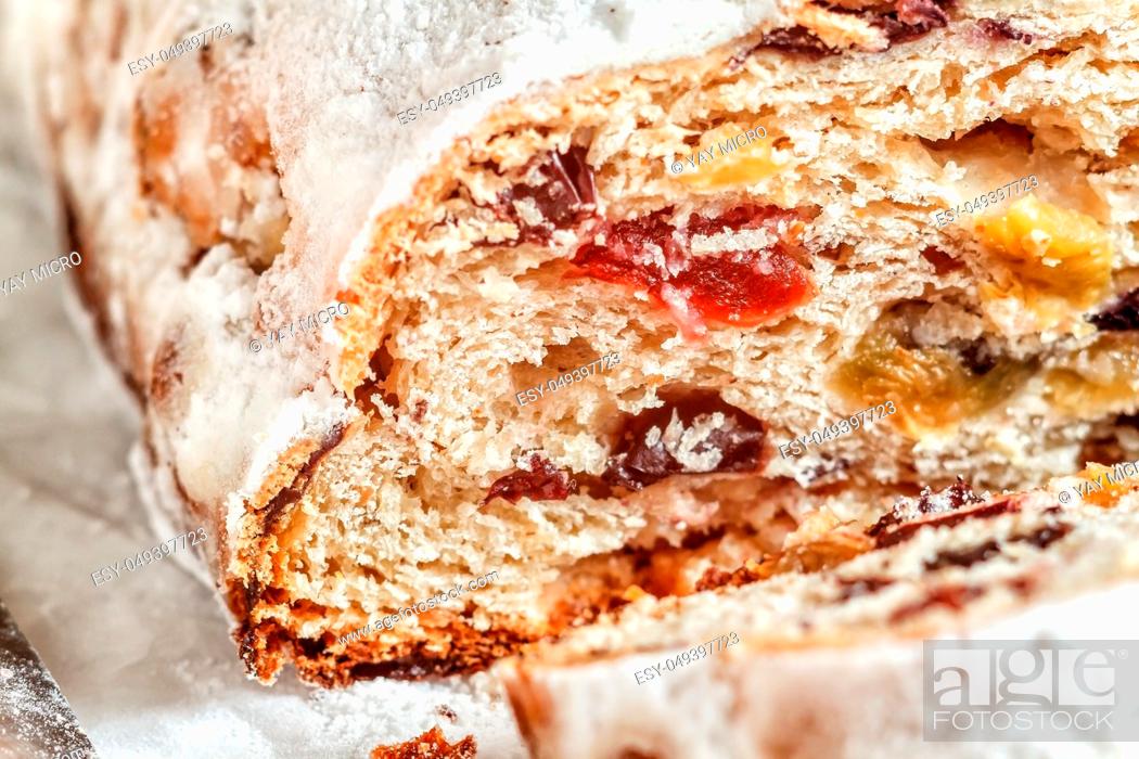 Stock Photo: A close-up shot of traditional Christmas stollen fruit cake. Sweet gift for Christmas. Selective focus.
