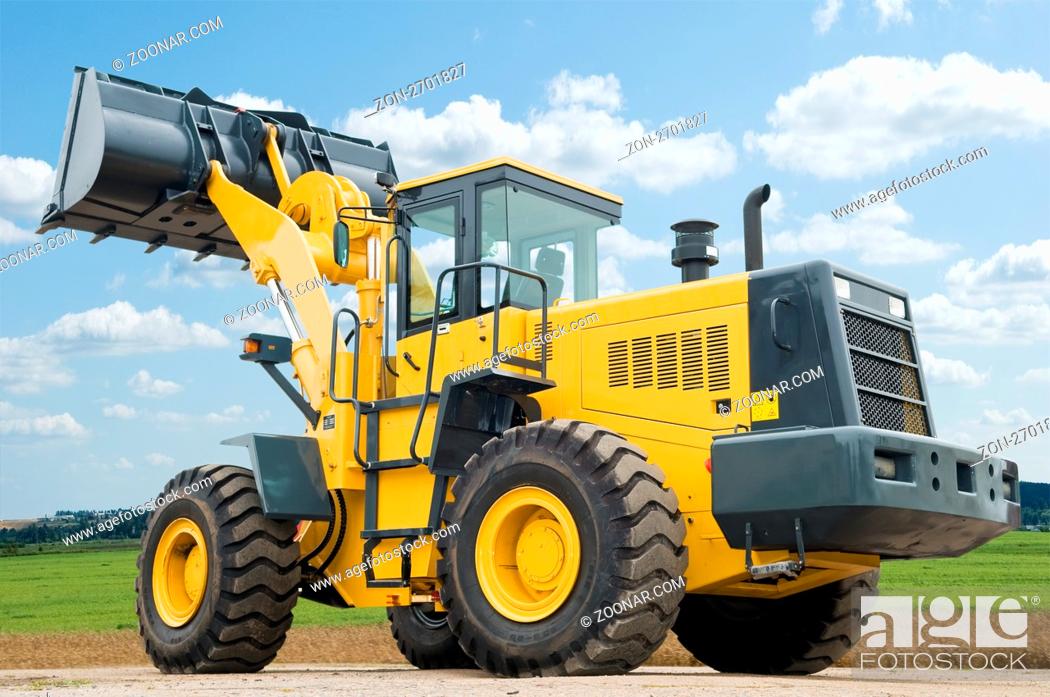 Stock Photo: One Loader excavator construction machinery equipment over blue sky.