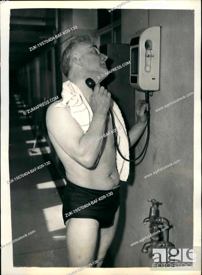 Stock Photo: Apr. 04, 1957 - A Sixpence-In-The-Slot Shave Is Introduced At Fulham Public Baths: The latest amenity offered to the British traveller is 'a shave for sixpence.
