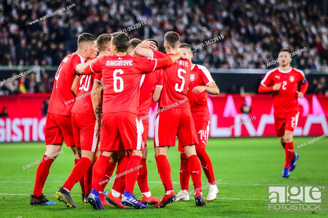 Stock Photo: Wolfsburg, Germany, March 20, 2019: Serbian national team celebrating a goal during the international soccer game Germany vs Serbia in Wolfsburg.