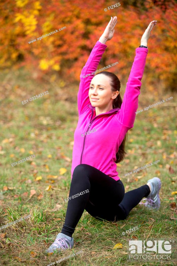 Stock Photo: Portrait of sporty beautiful happy young woman practicing fitness, standing in low lunge exercise on her knee, warming up.