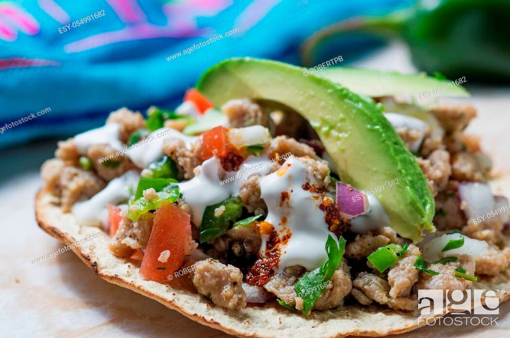Stock Photo: Vegetarian vegan ceviche on toasted tortillas. Mexican ceviche made of texturized vegetable protein with lime juice, jalapeno, onion and cilantro.