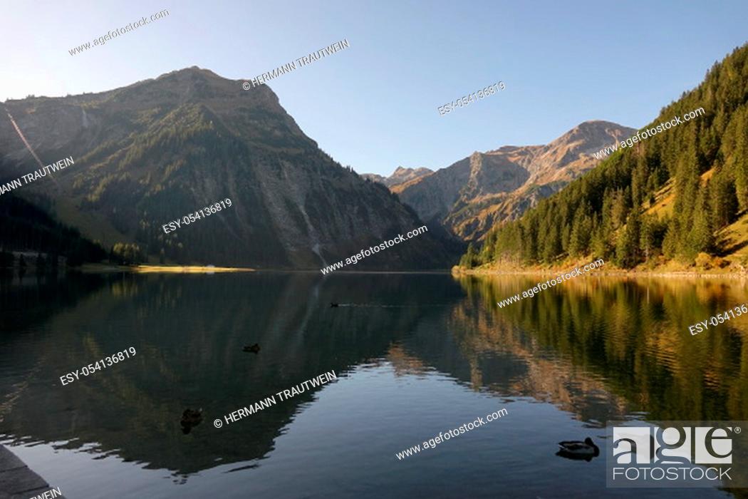 Stock Photo: The mountains in the Tannheimer Valley in Tyrol / Austria are reflected in the clear waters of the Vilsalpsee.