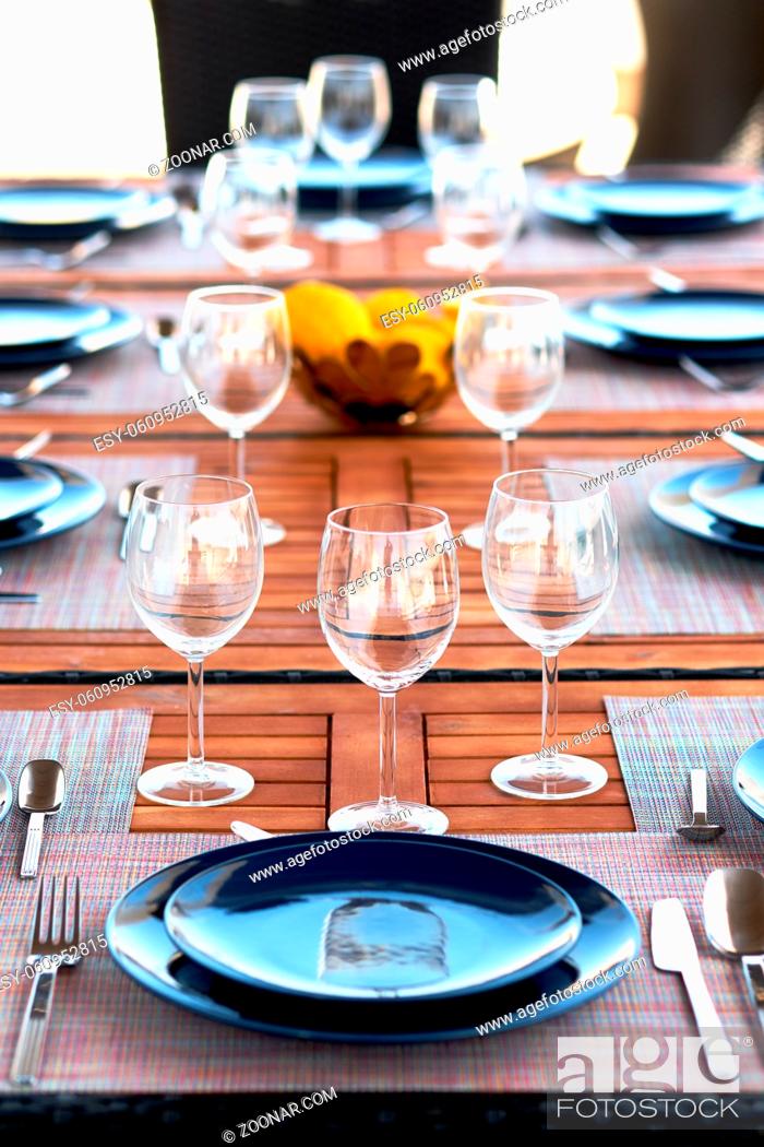 Stock Photo: Table setting with a wine glasses, cutlery and plates.